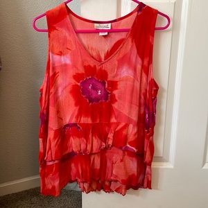 This is a med flowing tiered ruffle top .